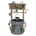 A whimsical miniature garden well featuring a rustic wooden structure with vines, a bucket, and colorful flowers.