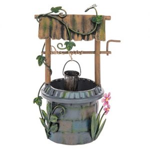 A whimsical miniature garden well featuring a rustic wooden structure with vines, a bucket, and colorful flowers.