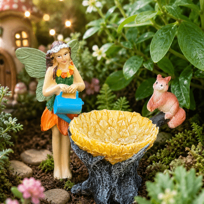 Standing Fairy Watering a Leaf Bird Bath with Squirrel